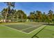 Beautiful community tennis courts with a green court, tall trees and shade at 24 Willowbend Dr., Murrells Inlet, SC 29576