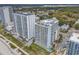 Aerial view of beachfront condos and a nearby pool at 2501 S Ocean Blvd. # 111, Myrtle Beach, SC 29577
