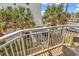 Scenic balcony view overlooking the parking lot and palm trees at 2501 S Ocean Blvd. # 111, Myrtle Beach, SC 29577