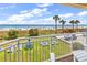 Enjoy ocean views from this lovely balcony overlooking green lawn and sandy beach with colorful umbrellas at 2501 S Ocean Blvd. # 111, Myrtle Beach, SC 29577