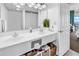 Bright bathroom featuring double sink vanity, stylish decor, and ample storage space at 2501 S Ocean Blvd. # 111, Myrtle Beach, SC 29577