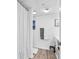 Cozy bathroom with shower, white and gray towels, and wood look flooring at 2501 S Ocean Blvd. # 111, Myrtle Beach, SC 29577