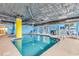 Bright indoor pool area with comfortable seating for lounging by the water at 2501 S Ocean Blvd. # 111, Myrtle Beach, SC 29577