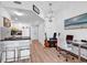 Stylish living space with modern decor, breakfast bar, and wood-look flooring at 2501 S Ocean Blvd. # 111, Myrtle Beach, SC 29577
