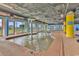Indoor pool with shallow water and mushroom water feature surrounded by lounge chairs at 2501 S Ocean Blvd. # 111, Myrtle Beach, SC 29577