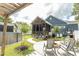 Landscaped backyard featuring a screened-in porch, fire pit and above-ground pool at 2588 Long Avenue Ext., Conway, SC 29526