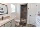 Bathroom with granite countertop, framed mirror and step-in tiled shower with built-in niche at 2588 Long Avenue Ext., Conway, SC 29526