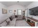 Inviting living room with vaulted ceilings, comfortable seating, and bright natural light shining through the windows at 2588 Long Avenue Ext., Conway, SC 29526