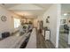 Cozy living room with hardwood flooring and open concept to dining area with lots of natural light at 2588 Long Avenue Ext., Conway, SC 29526