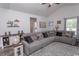 Bright living room with a vaulted ceiling, stylish decor, and an extra-large sectional for relaxing at 2588 Long Avenue Ext., Conway, SC 29526