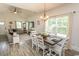 Open-concept living and dining area featuring a large window and modern furnishings at 2588 Long Avenue Ext., Conway, SC 29526