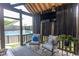 Covered patio with comfortable seating, outdoor curtains and a view of the backyard pool at 2588 Long Avenue Ext., Conway, SC 29526