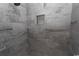 Close up of tiled step-in shower with built-in niche for storage at 2588 Long Avenue Ext., Conway, SC 29526