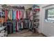 Walk-in closet with metal shelving, laminate wood flooring and ample storage for clothes and shoes at 2588 Long Avenue Ext., Conway, SC 29526