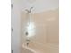 Bright bathroom featuring a shower-over-tub with adjustable shower head and neutral tones at 2595 Buck Scrape Rd., Myrtle Beach, SC 29588