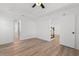 Bright bedroom boasts vaulted ceiling, ceiling fan, and wood-look flooring at 2595 Buck Scrape Rd., Myrtle Beach, SC 29588