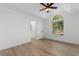 Vaulted bedroom features light-filled window and neutral flooring at 2595 Buck Scrape Rd., Myrtle Beach, SC 29588