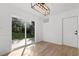 Bright dining room featuring hardwood floors and sliding glass doors to the backyard at 2595 Buck Scrape Rd., Myrtle Beach, SC 29588
