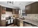 Modern kitchen featuring stainless steel appliances, marble backsplash, and updated granite countertops at 2595 Buck Scrape Rd., Myrtle Beach, SC 29588