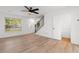 Bright living room with hardwood floors, a ceiling fan and stairs to the upper level at 2595 Buck Scrape Rd., Myrtle Beach, SC 29588