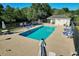 Community pool area with lounge chairs, tables, and well-maintained landscaping at 2595 Buck Scrape Rd., Myrtle Beach, SC 29588