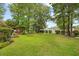 Spacious backyard featuring a hammock, pergola, and garden at 2636 Brick Dr., Longs, SC 29568