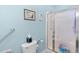 Bathroom with shower, toilet, grab bar and light blue paint at 2636 Brick Dr., Longs, SC 29568