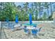 Community pool with lounge chairs, umbrellas, and lovely pool decking at 2636 Brick Dr., Longs, SC 29568