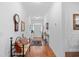 Inviting foyer with hardwood floors, decorative accents, and ample natural light at 2636 Brick Dr., Longs, SC 29568