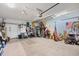 Spacious two car garage with ceiling fan, storage and stairs at 2636 Brick Dr., Longs, SC 29568
