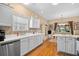 Well-lit kitchen featuring white cabinets, modern appliances, and a breakfast nook at 2636 Brick Dr., Longs, SC 29568