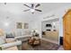 Comfortable living room with soft gray sofa, decorative rug, and an opening to another room at 2636 Brick Dr., Longs, SC 29568