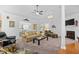 Spacious living room featuring a fireplace, plush carpet, and abundant natural light at 2636 Brick Dr., Longs, SC 29568