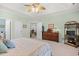 Spacious main bedroom with oak dresser, decor and open doors at 2636 Brick Dr., Longs, SC 29568