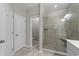 Contemporary bathroom featuring a glass-enclosed shower, neutral tile, and modern fixtures at 281 Lumbee Circle, Pawleys Island, SC 29585