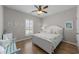 Cozy bedroom with white furniture, beach-themed decor, and wood flooring at 281 Lumbee Circle, Pawleys Island, SC 29585