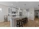 Open kitchen with a large island, granite countertops, stainless steel appliances, and modern lighting at 281 Lumbee Circle, Pawleys Island, SC 29585