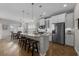 Spacious open-concept kitchen and dining area with granite counters, stainless appliances, and seating at the island at 281 Lumbee Circle, Pawleys Island, SC 29585