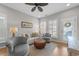 Bright living room with stylish furniture, ceiling fan, and natural light at 281 Lumbee Circle, Pawleys Island, SC 29585