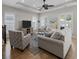 Comfortable living room with natural lighting, ceiling fan, and stylish furnishings at 281 Lumbee Circle, Pawleys Island, SC 29585