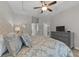 Spacious main bedroom with tray ceiling, dresser, and a glimpse into the hallway at 281 Lumbee Circle, Pawleys Island, SC 29585