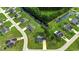 Aerial view of a brick home located near a pond, showcasing the neighborhood layout at 301 Farmtrac Dr., Aynor, SC 29544