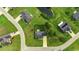 A birds-eye view of a brick home with a large yard in a neighborhood with ponds at 301 Farmtrac Dr., Aynor, SC 29544