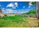 Spacious backyard featuring a well-maintained lawn and a tall wooden privacy fence at 301 Farmtrac Dr., Aynor, SC 29544