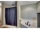 Bathroom featuring shower with curtain and soaking tub at 301 Farmtrac Dr., Aynor, SC 29544