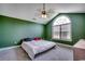 Bedroom features a large arched window, fan and plush carpet at 301 Farmtrac Dr., Aynor, SC 29544