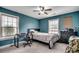 Bedroom featuring two windows, fan and carpet at 301 Farmtrac Dr., Aynor, SC 29544
