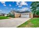 Charming single-story brick home with a two-car garage and meticulously maintained landscaping at 301 Farmtrac Dr., Aynor, SC 29544