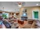 Inviting living room featuring hardwood floors, comfortable couches, and a ceiling fan at 301 Farmtrac Dr., Aynor, SC 29544