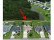 Aerial view of neighborhood homes near a pond at 348 Basswood Ct., Conway, SC 29526